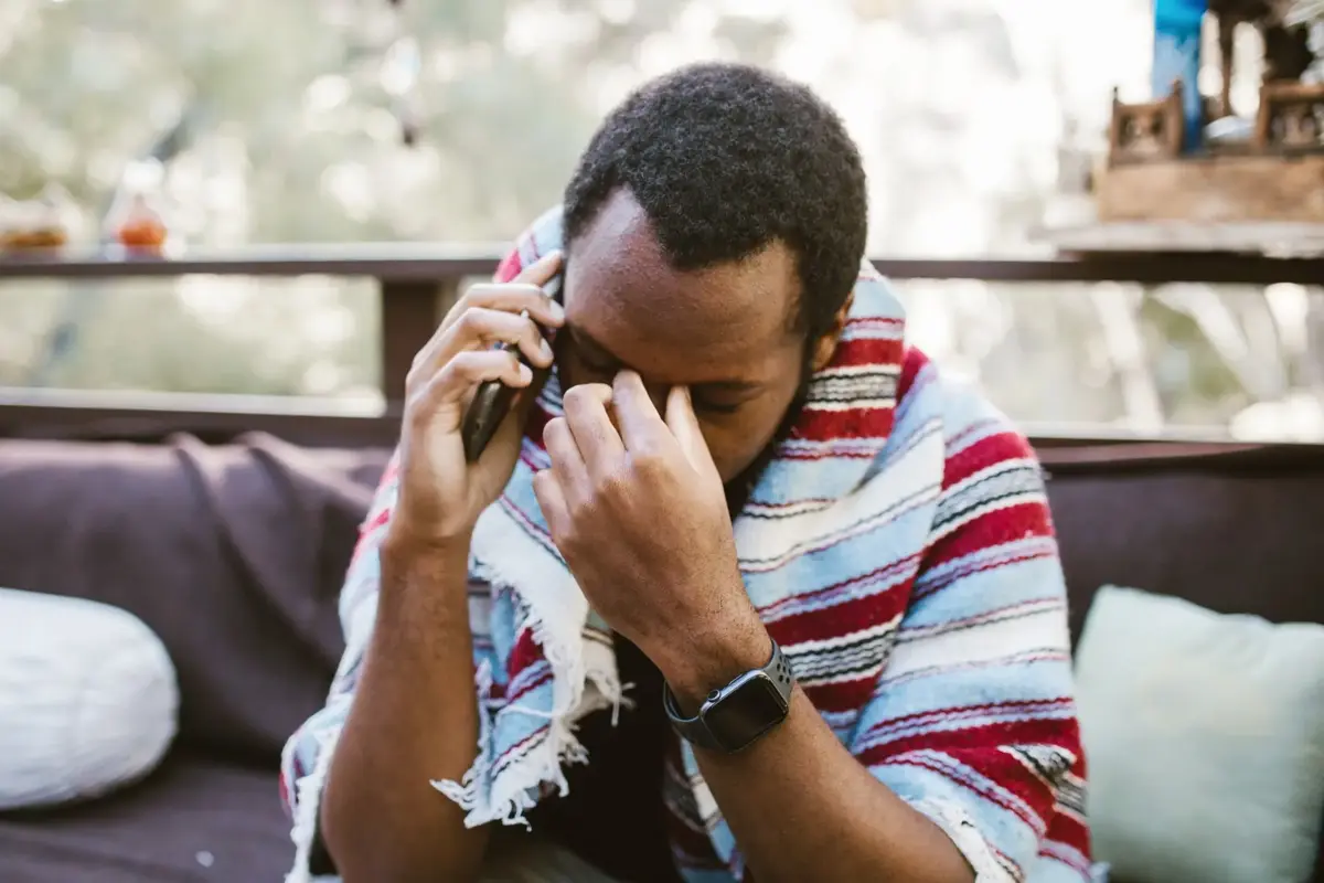 a foreign man talking to his girlfriend over the phone