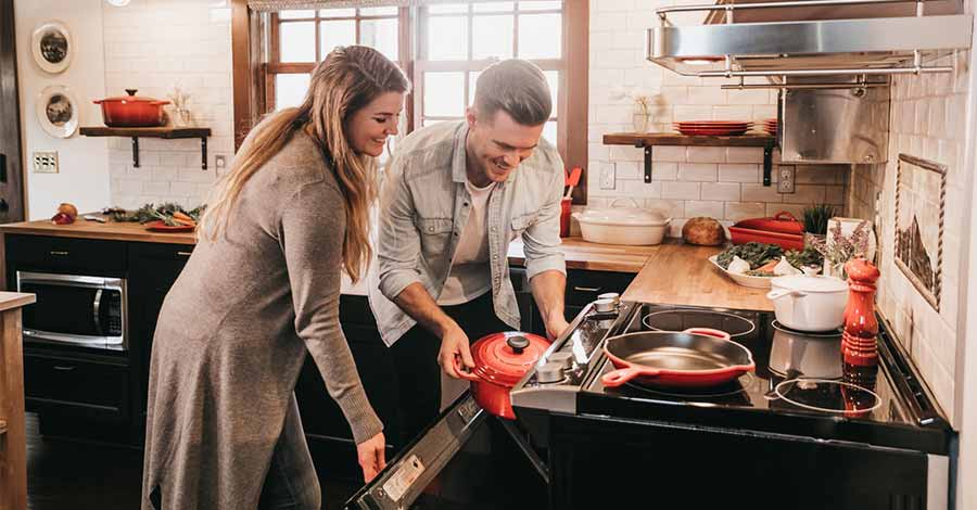 A couple in the kitchen.