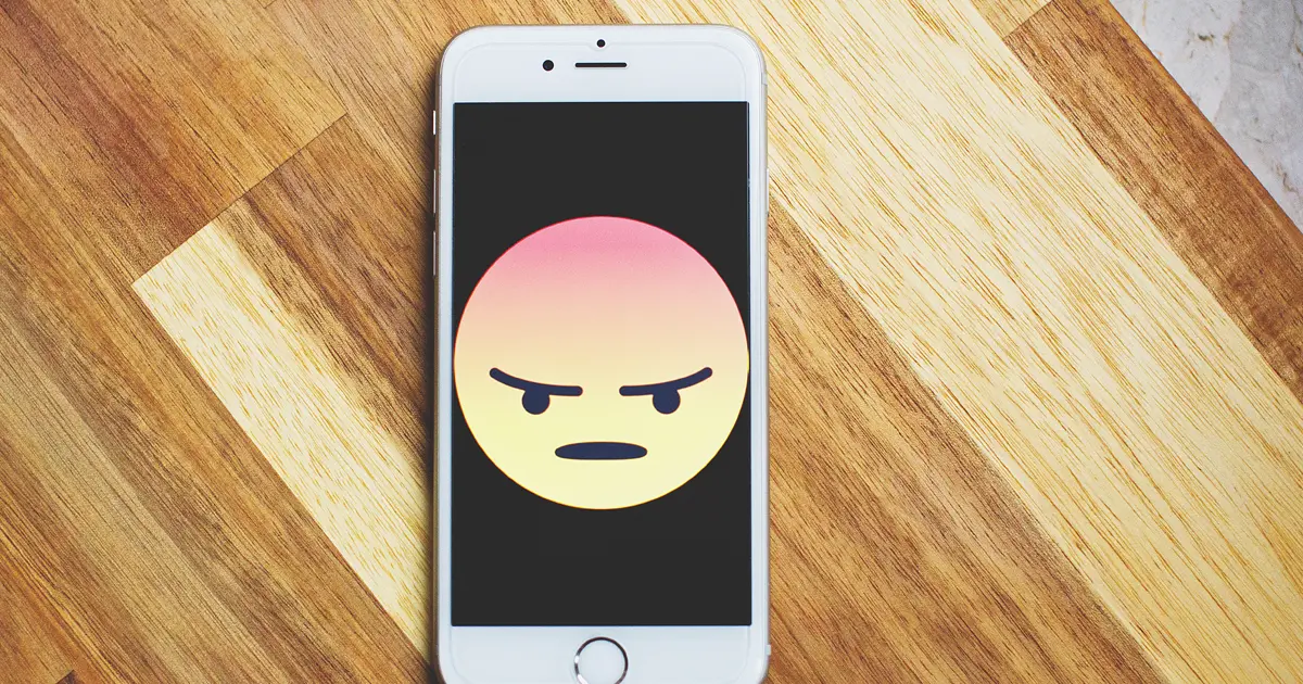 phone with angry emoji